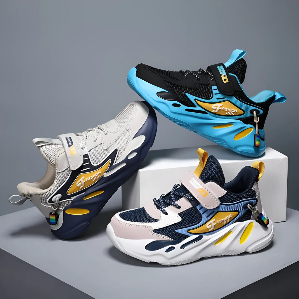 Boys dark blue and beige sports running shoes with Velcro strap and mesh upper.