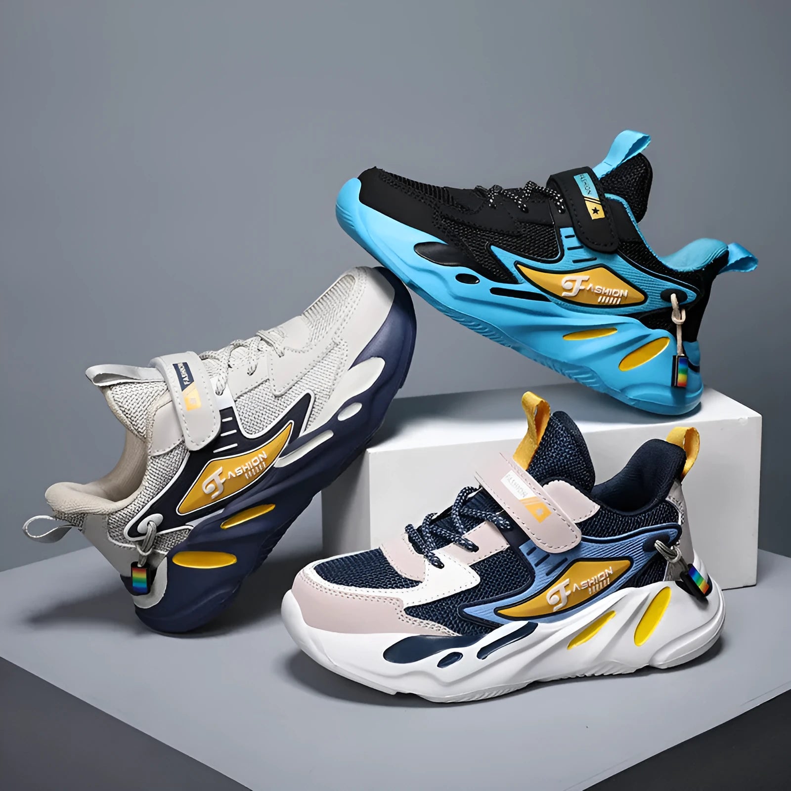 Boys dark blue and beige sports running shoes with Velcro strap and mesh upper.