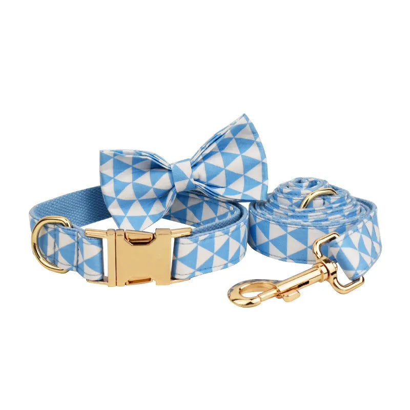 Blue cloth dog collar, leash, bow, and vest four-piece pet accessory set with triangular ring rope design.