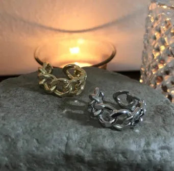 Golden aluminium alloy adjustable geometric ring chain on white background