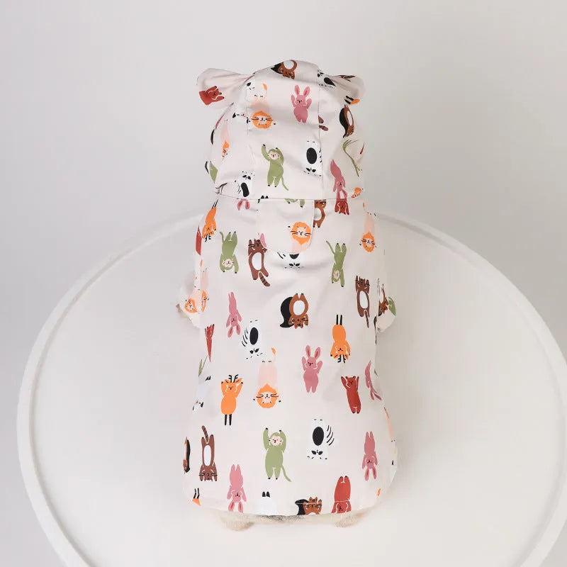 Beige dog raincoat with cartoon small animal print, showing PU waterproof material