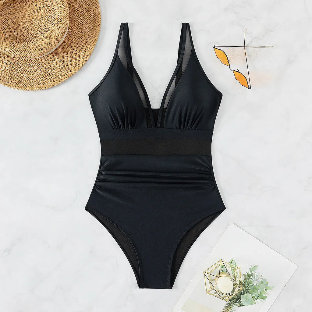 Black women's one-piece swimsuit with mesh halter detailing and sleeveless briefs style