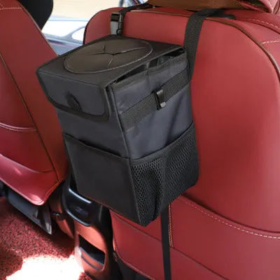 Black Oxford cloth car trash can with hanging strap, mesh pockets, and Velcro lid