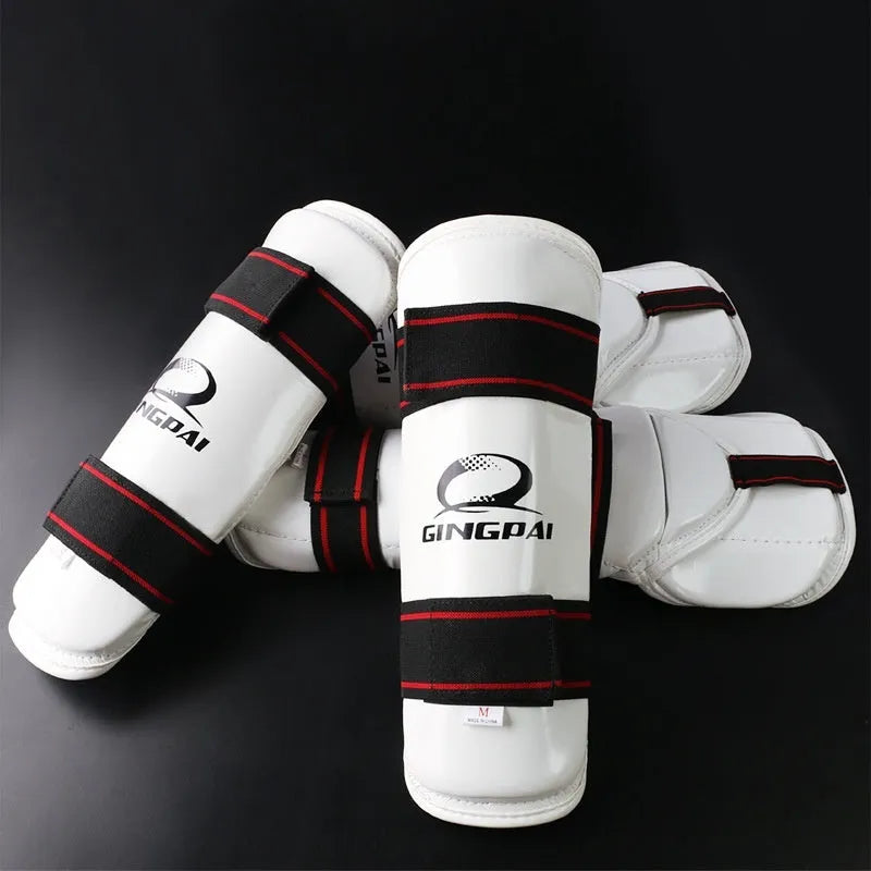 Taekwondo leg and arm protective gear set showing arm guards, leg protectors, and elbow guards