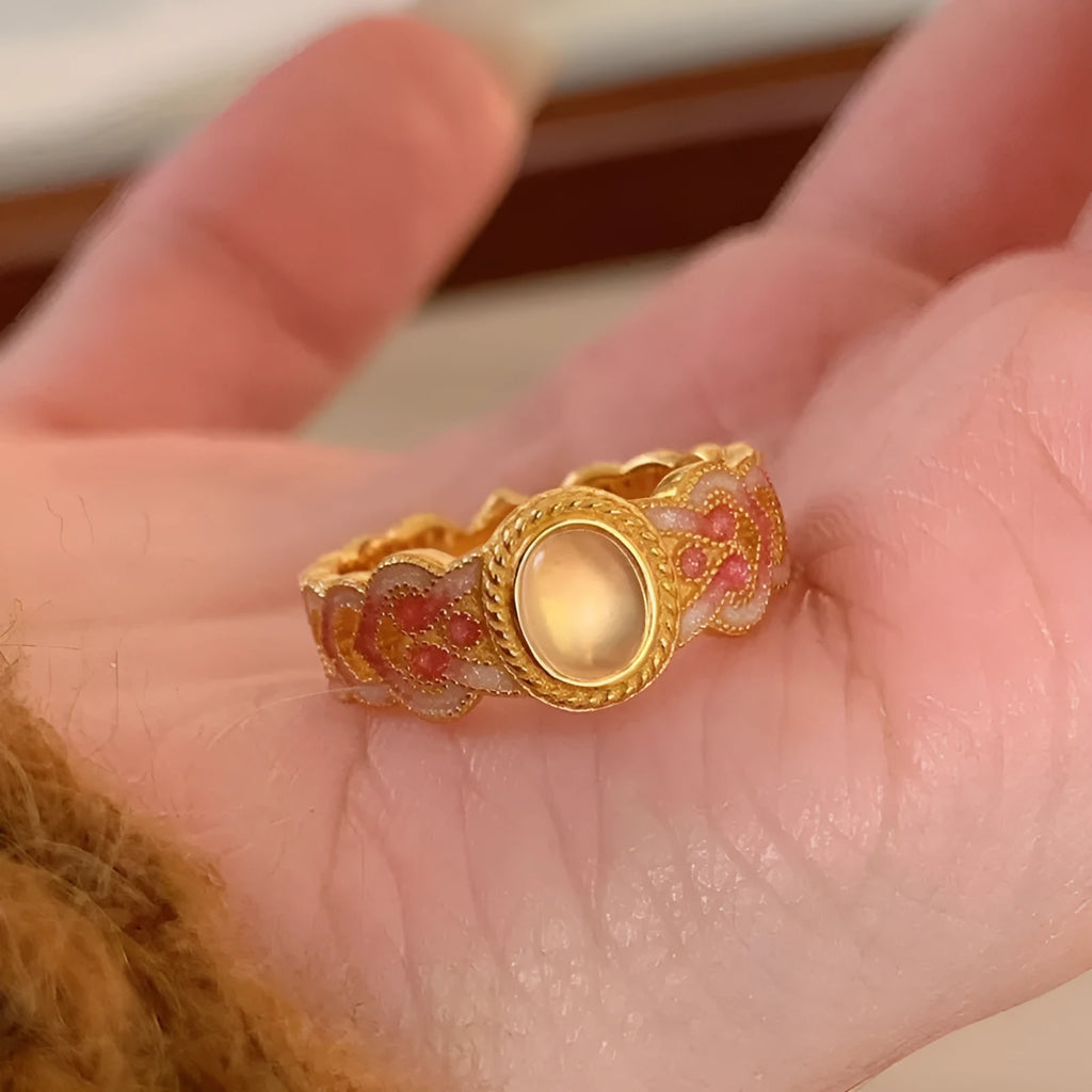 Pink crystal enamel geometric open ring on gold-plated copper band for women.