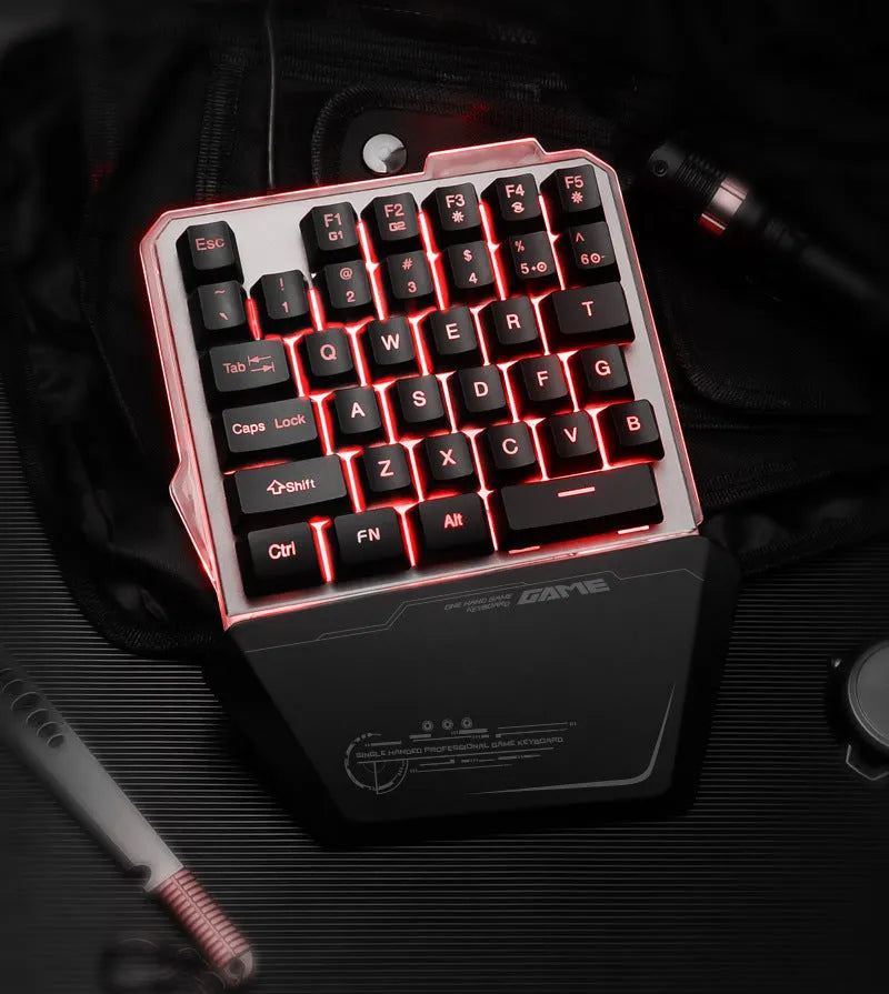 G40 Flow Colour black one-handed robotic keyboard with RGB backlit keys on a desk