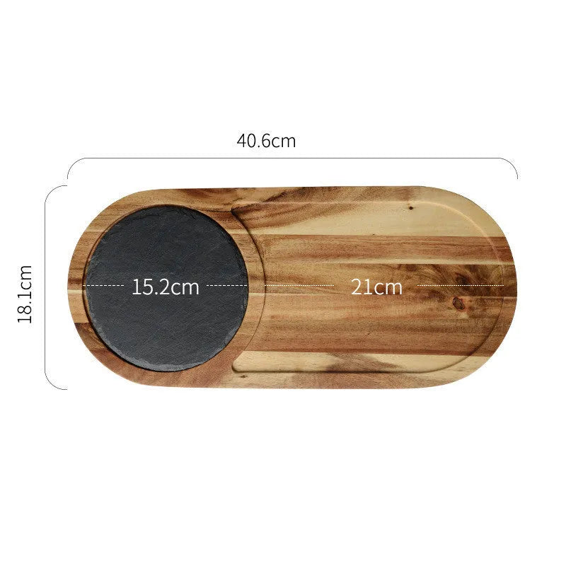 Black wooden pizza dish made from acacia wood and stone, multi-colour sets, on a table