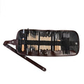 Brown OPP bag containing 27-piece pottery tool set with stainless steel, wood, and plastic sculpting implements.