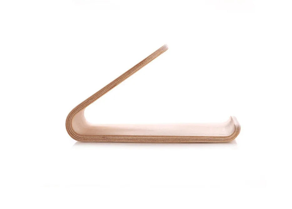 Wooden iPhone stand in walnut finish on a desk holding a mobile phone.