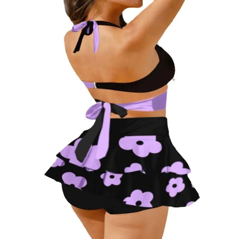 Women's purple bikini with matching skirt showing lace-up back design and high-waisted briefs