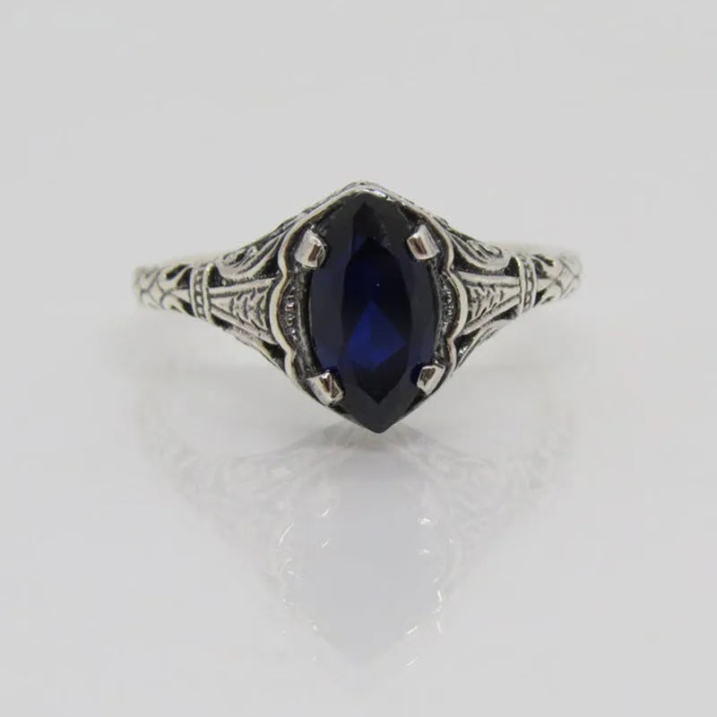 Women's silver geometric hollow-out alloy ring showing detailed pattern and zircon elements