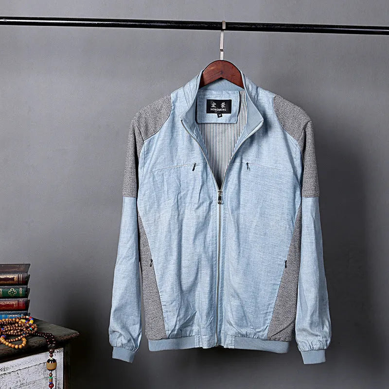 Men's thin blue cotton linen jacket on a hanger, showing regular cut and front button design.