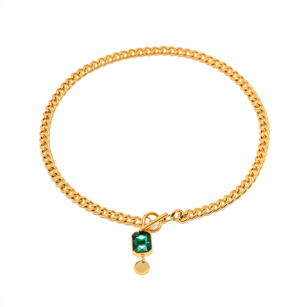 Gold geometric round zircon pendant necklace on a titanium steel Cuban link chain.