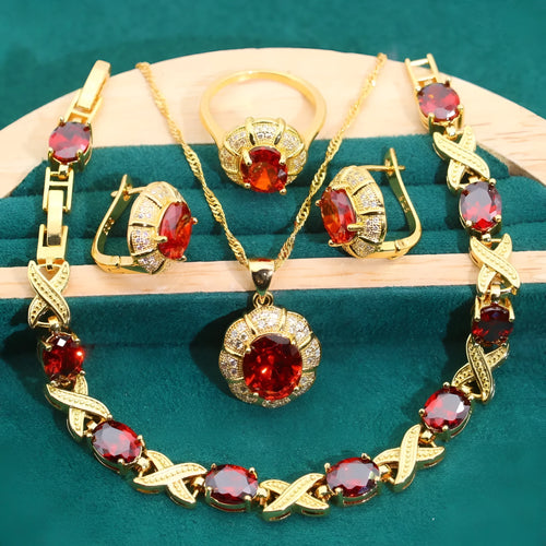 Gold plated zircon jewellery set with necklace, earrings, ring, and bracelet on display.