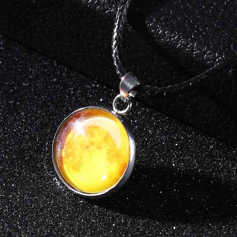 Luminous moon and constellation night sky pendant on an extendable alloy necklace chain.
