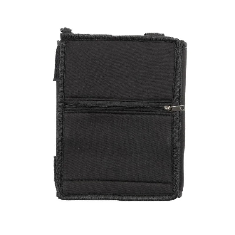 Black canvas large capacity packing tote folded flat on a surface, showing its storage pouch design