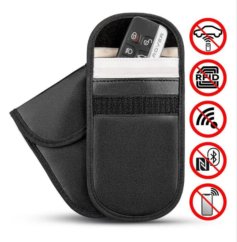 Black microfibre Faraday pouch for blocking car key, phone, and bank card signals, shown with a key fob inside.