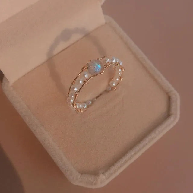 Grey Moonlight Pearl Ring with natural moonstone and blue labradorite crystal on finger, women's ring size model