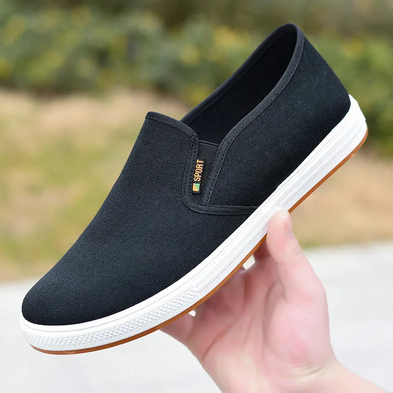 Men's low-top canvas slip-on cloth shoes in black or blue with round toe and composite sole