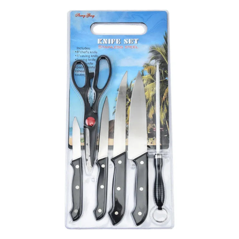 Stainless steel knife with 17.5cm blade and black A-style cutting board on kitchen countertop