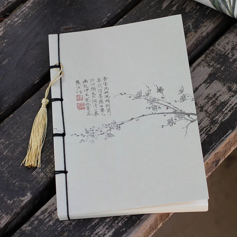 A5 antique thread-bound notebook with embossed cover and decorative tassels