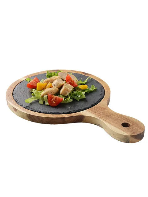 Black wooden pizza dish made from acacia wood and stone, multi-colour sets, on a table