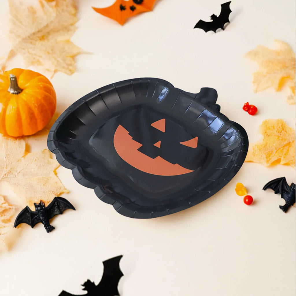 Black Halloween disposable paper plates with pumpkin design in 9-inch size