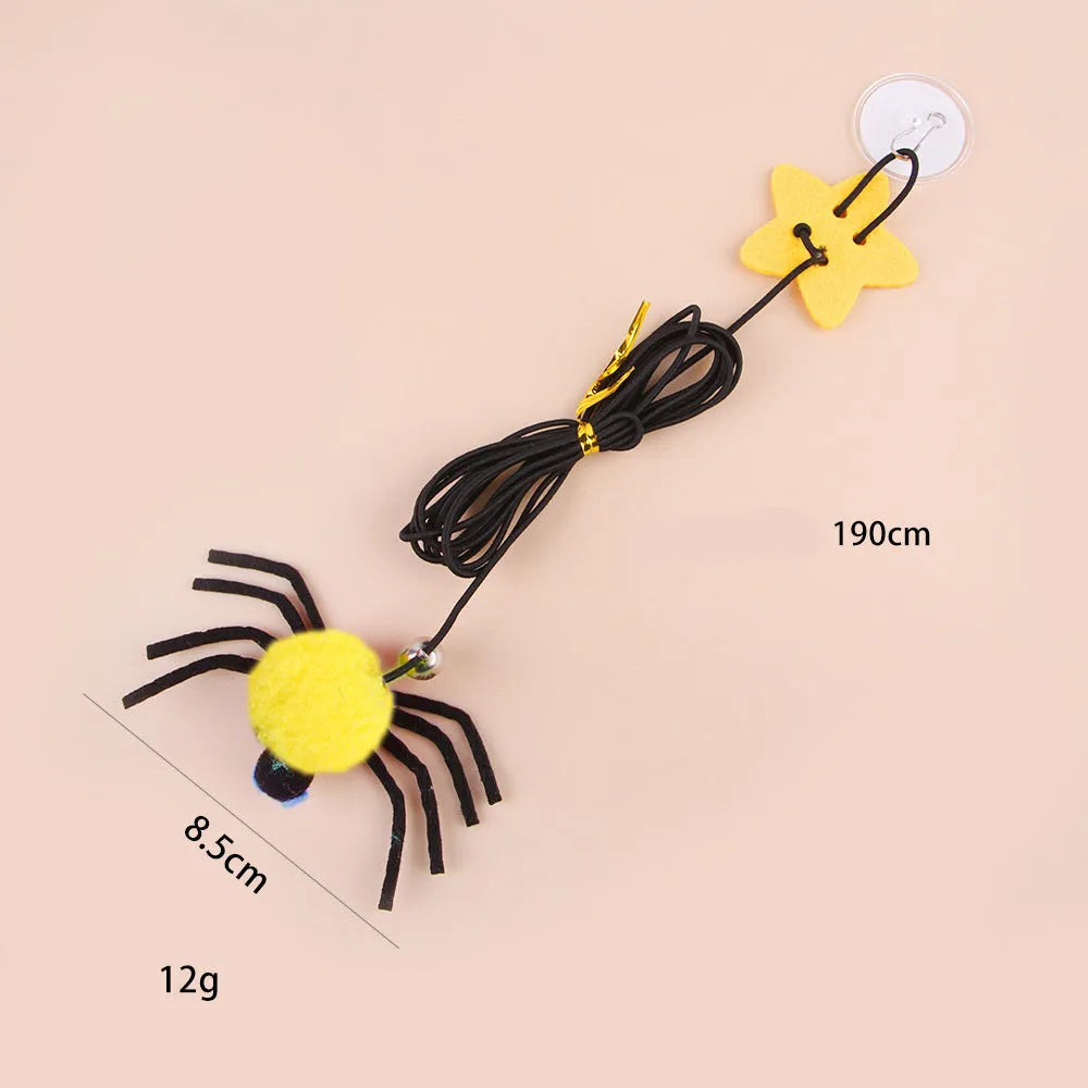 Cat hanging door toy with elastic rope featuring feather, bell and spider attachments in red or yellow colours