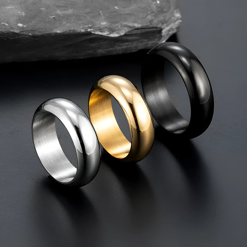 Glossy electroplated titanium steel ring in gold, black, and steel colour showing size range 7-12