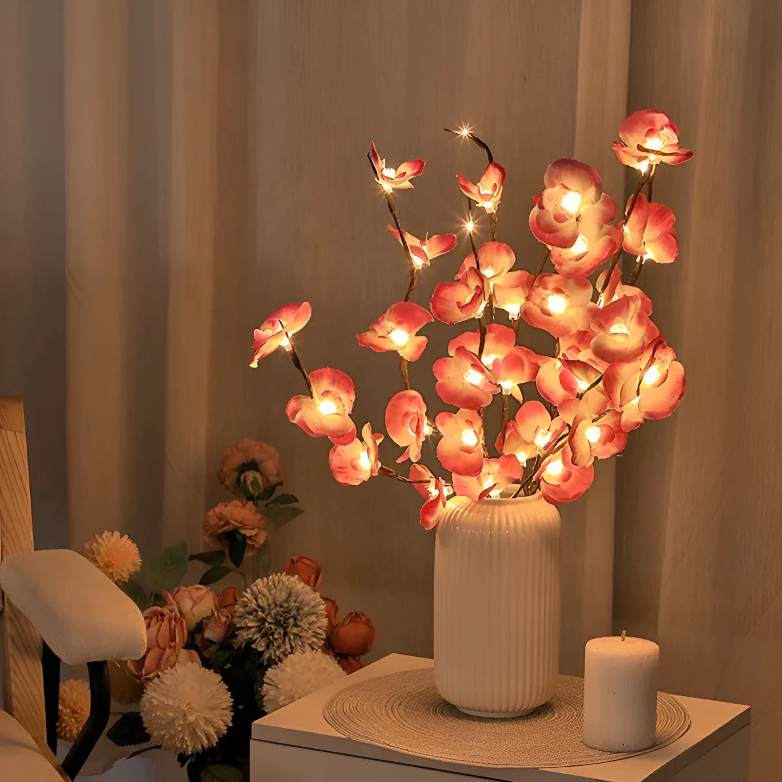 Pink LED Phalaenopsis orchid branch decorative light measuring 65cm long for bedroom walls.