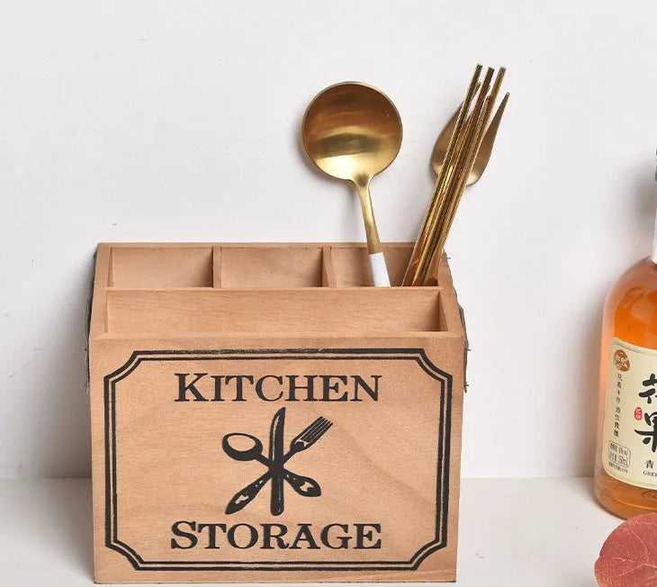 Open-top wooden kitchen storage box with internal grid divider for knives, forks, and chopsticks.