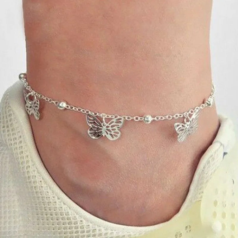 Alloy butterfly anklet for women in gold finish on ankle, hollow design beach foot ornament