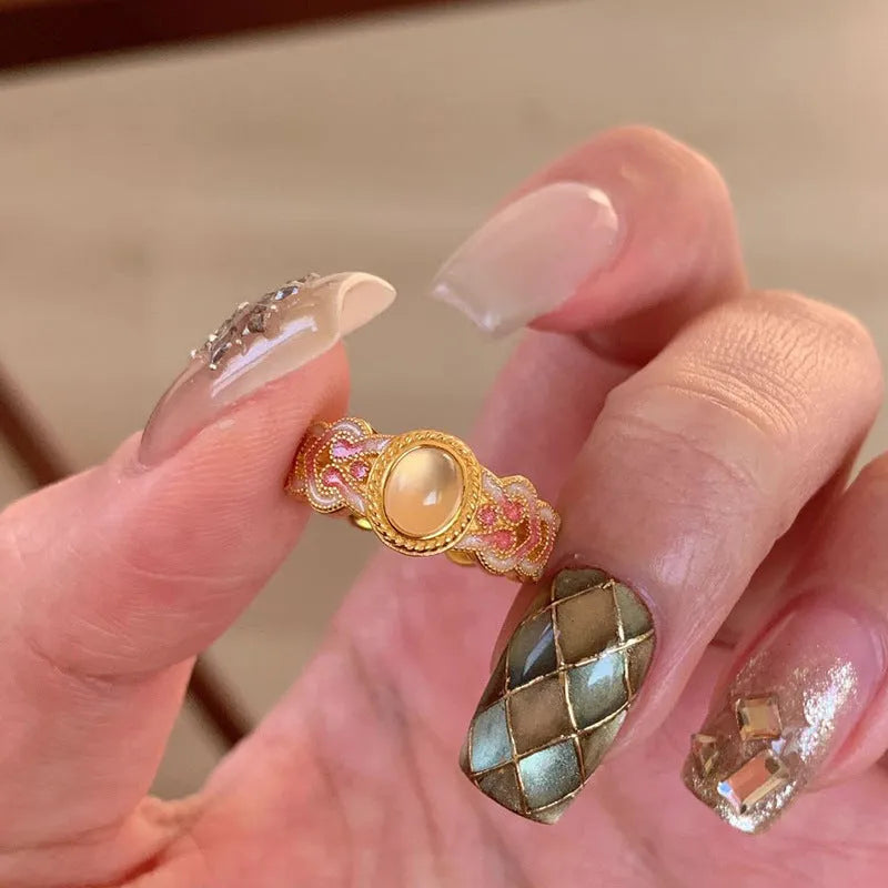 Pink crystal enamel geometric open ring on gold-plated copper band for women.