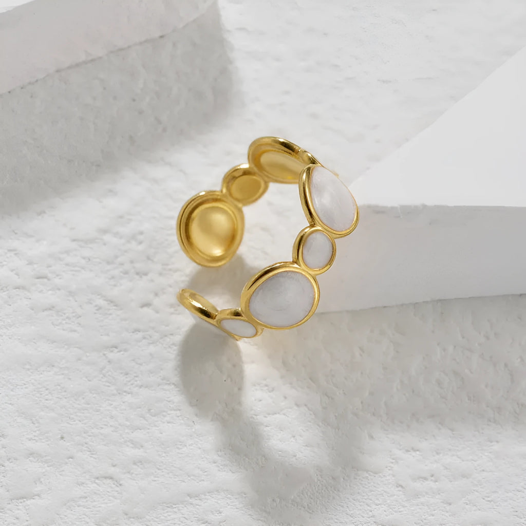 Stainless steel geometric ring with adjustable opening and electroplated metallic finish