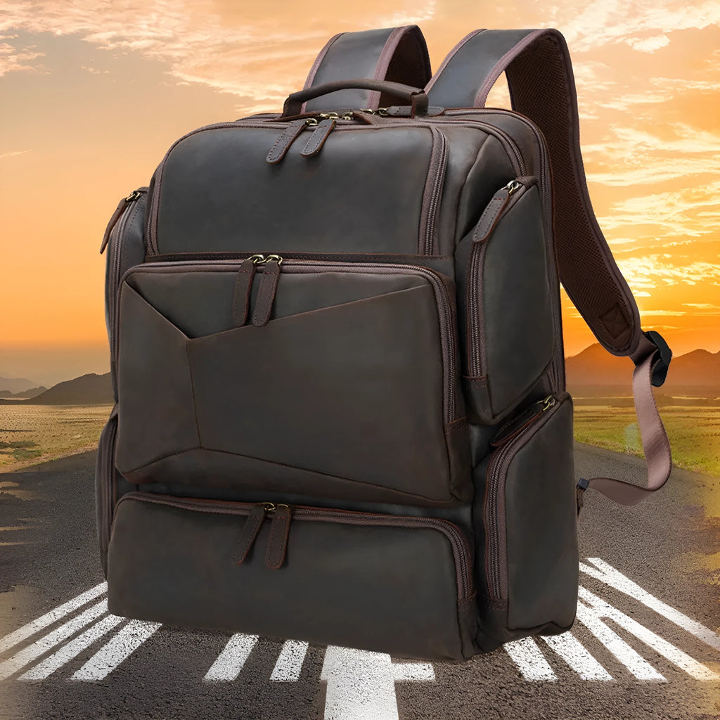 Dark brown retro crazy horse leather men's backpack with a 17-inch laptop compartment and double straps.