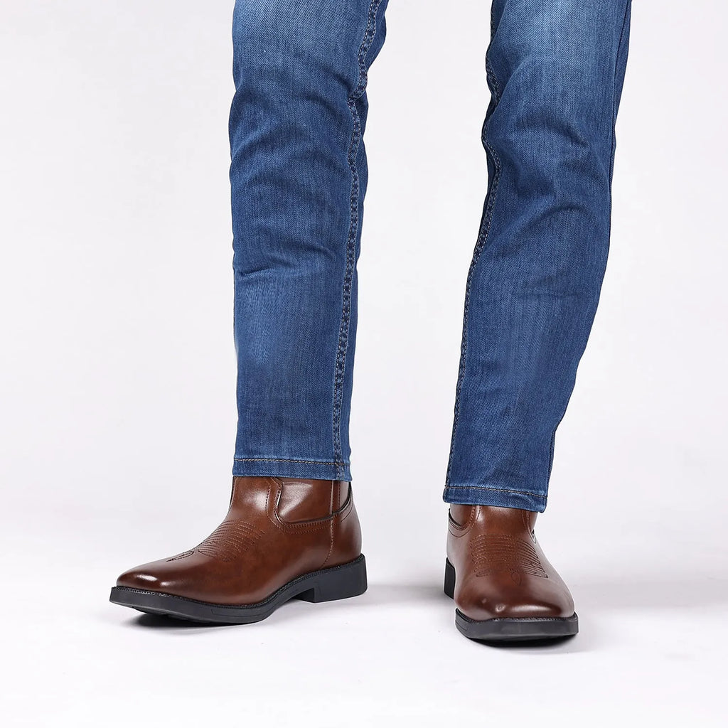 Brown retro wide head cowboy boots with embroidery, square toe, and a low heel on a plain background.