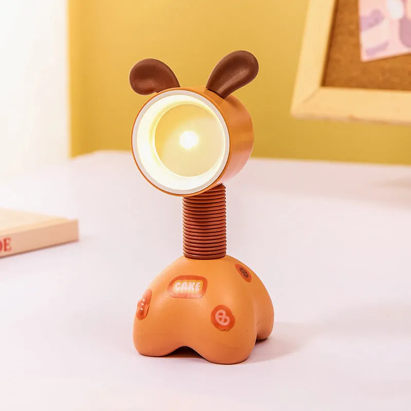 DIY cartoon magnetic small night lamp in assorted animal styles and colours on a desktop.
