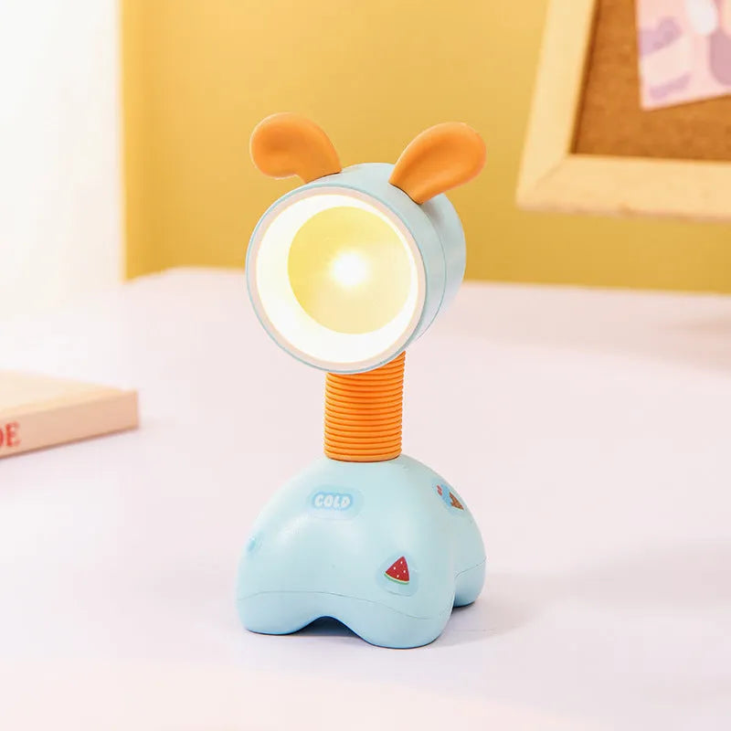 DIY cartoon magnetic small night lamp in assorted animal styles and colours on a desktop.