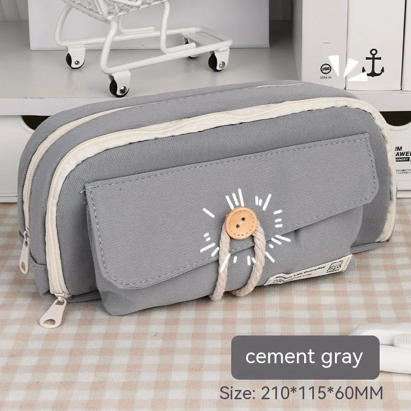 Green Korean-style canvas pencil case open, showing large capacity for pens and stationery.