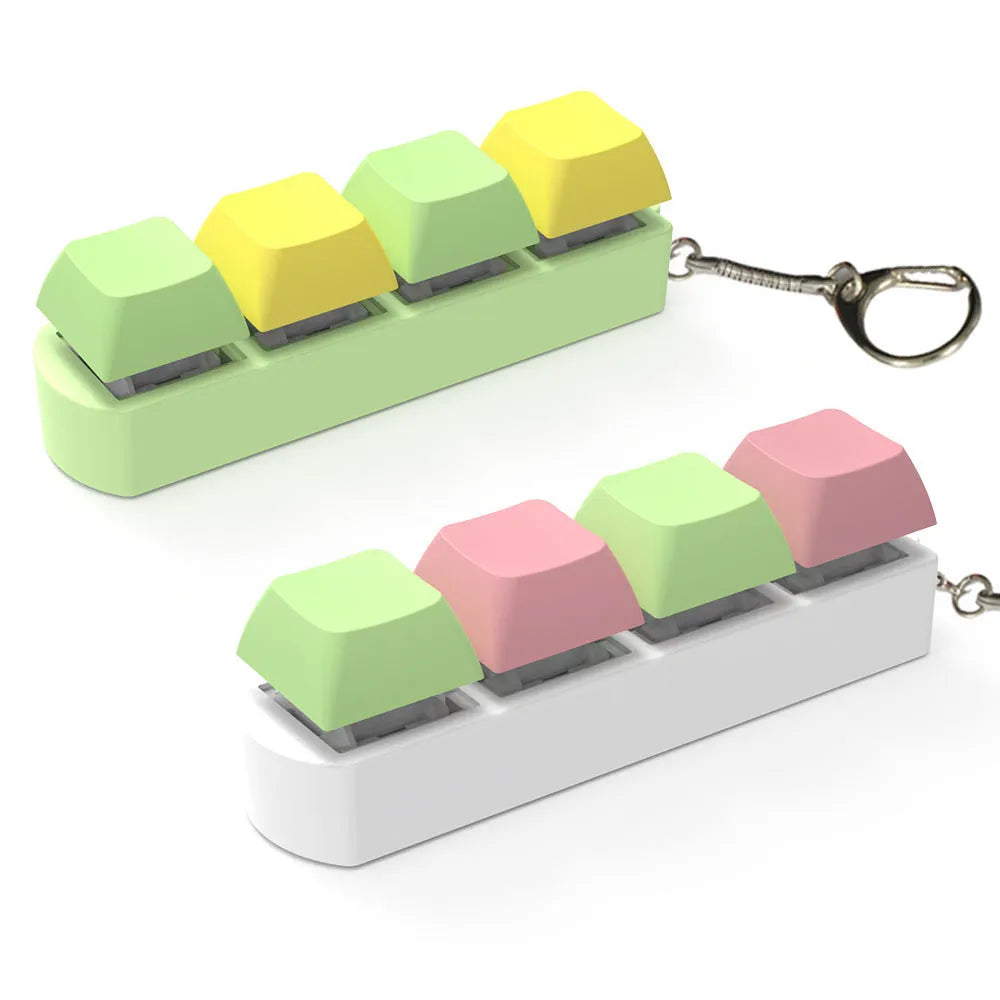 A blue, orange, yellow, and purple 4-key shaft tester fidget toy with a transparent bottom shell.