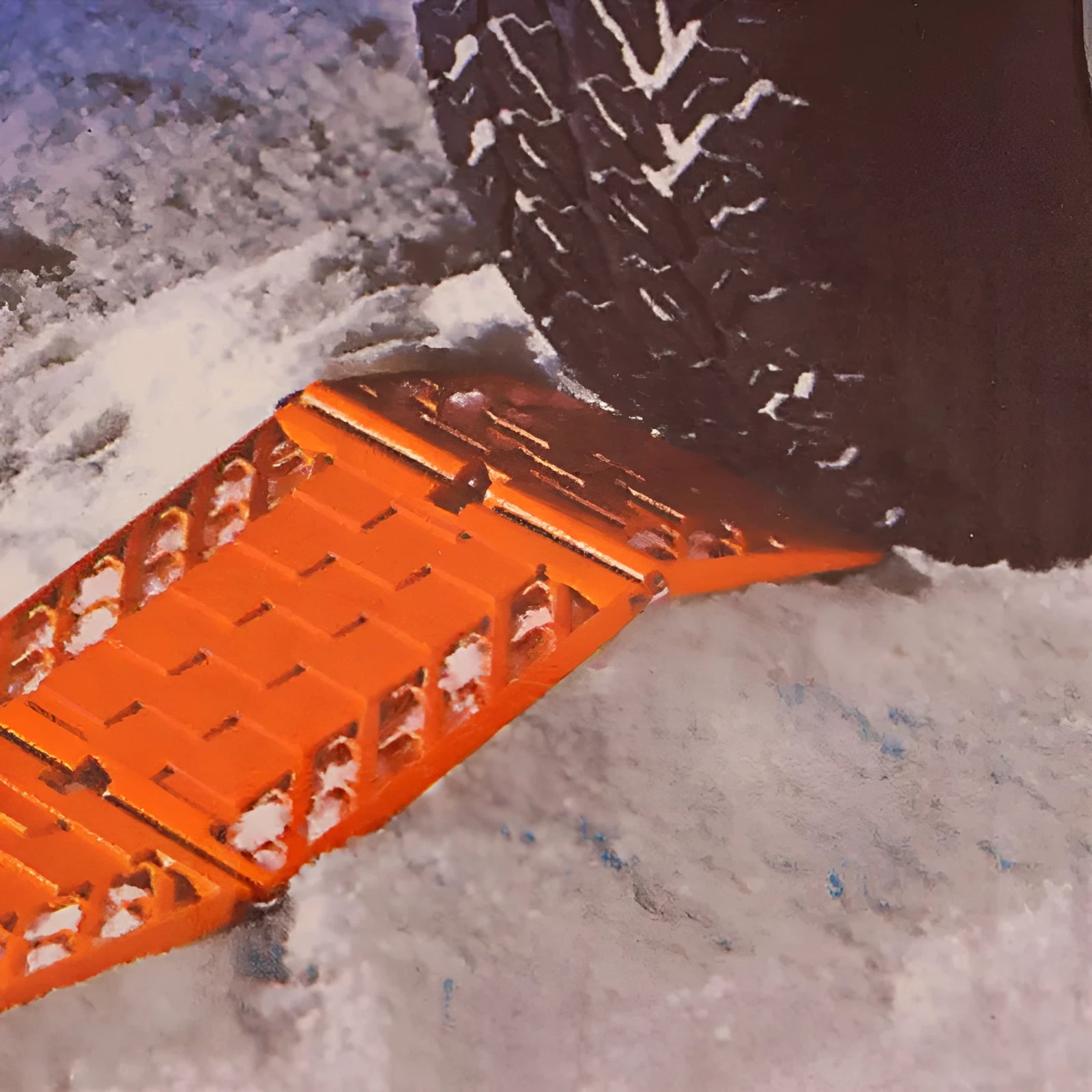 Orange folding rescue boards for vehicle recovery in mud and snow conditions