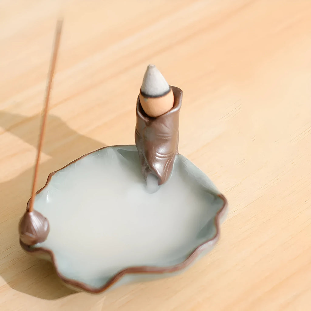 Square purple clay ceramic incense burner with reverse flow design and lotus decoration