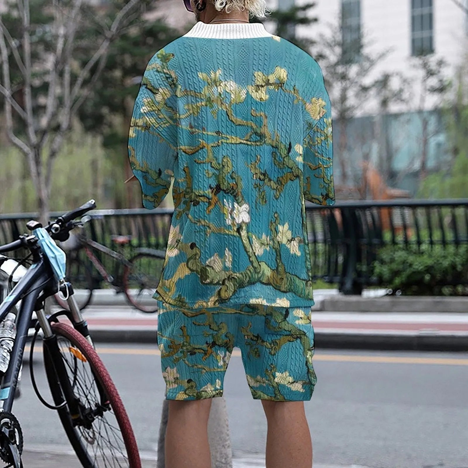 Men's peacock blue 3D printed knitted shorts suit with matching T-shirt, showing fifth-pant length trousers