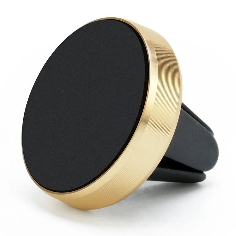 Magnetic car phone holder mounted on vehicle air vent in rose gold colour