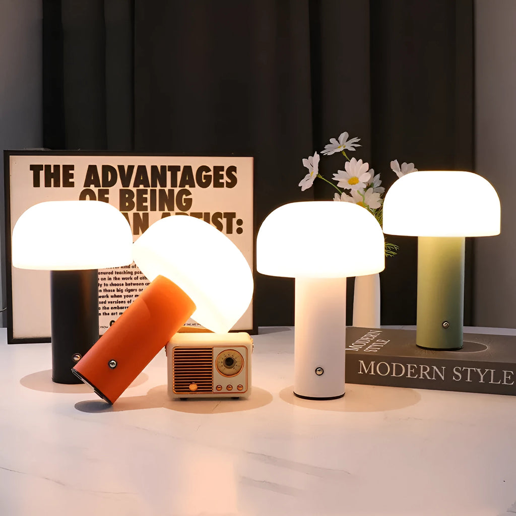 USB-powered plastic table lamp in a choice of black, green, orange, or white colour styles on a desk.
