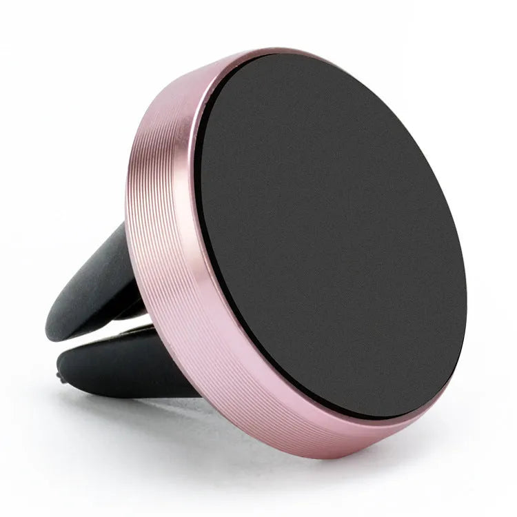 Magnetic car phone holder mounted on vehicle air vent in rose gold colour