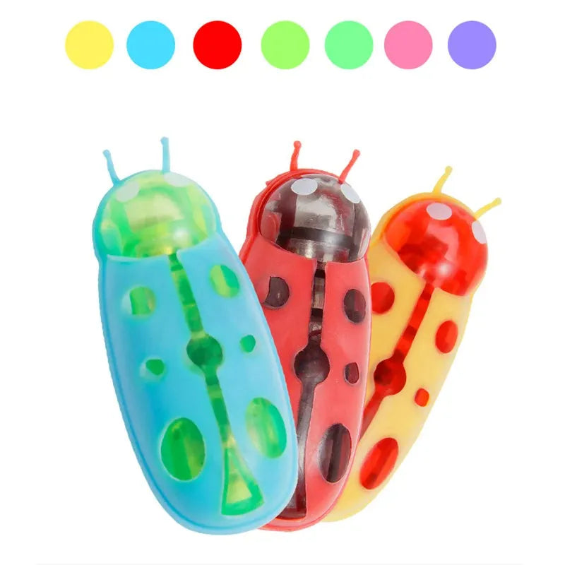 Mini electric bug pet toy with ladybird design on wooden floor