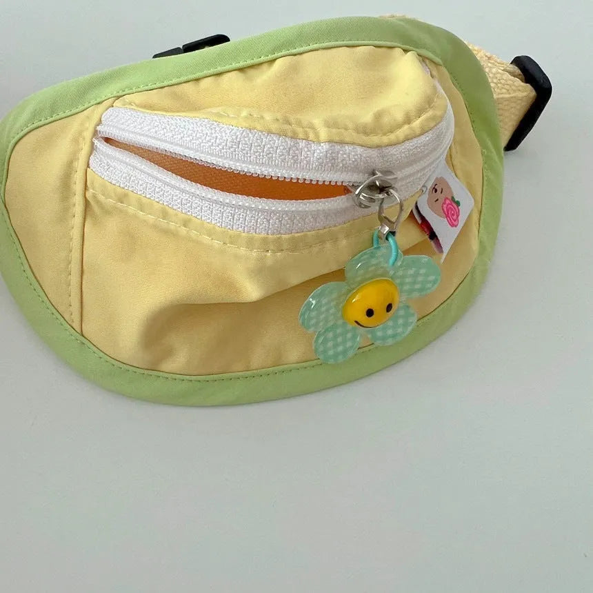 Backpack-style pet waste bag dispenser in messenger bag design showing S and M size options