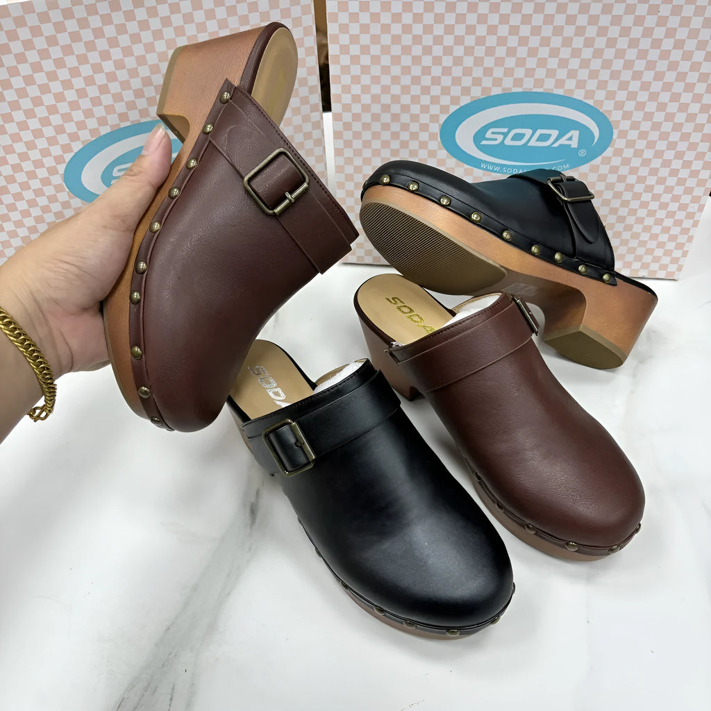 Black retro chunky heel slippers with closed toe and metal rivet details on the microfiber upper.