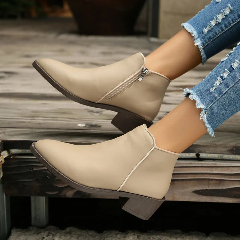 Women's chunky mid heel suede ankle boots with side zipper in off-white, front view